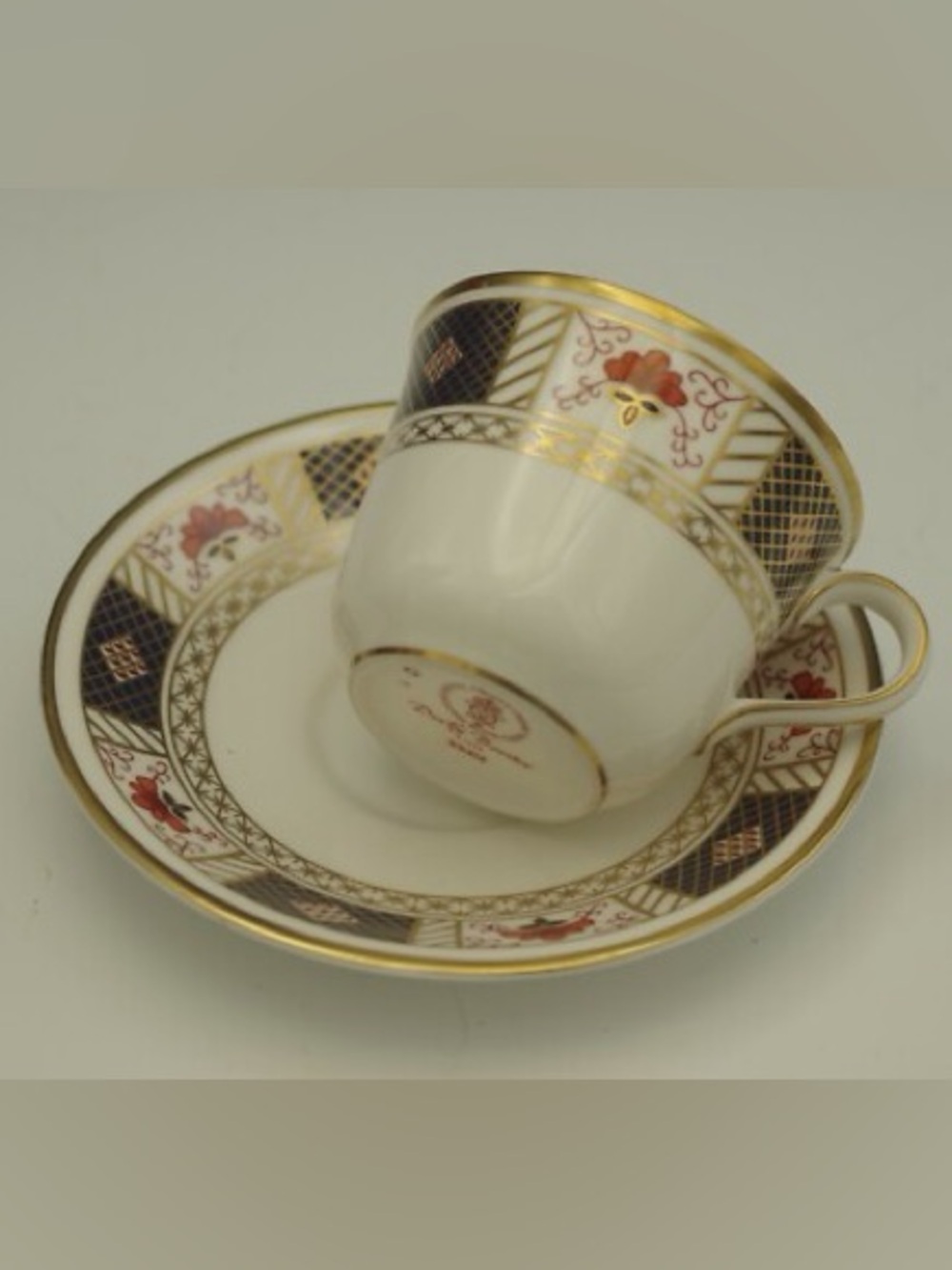 Royal Crown Derby Gold-Trimmed “Derby Boarder” China Teacup and Saucer